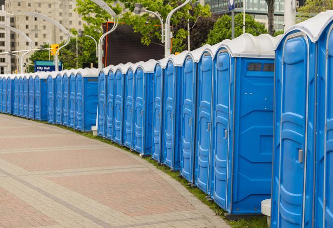 a row of portable restrooms at a fairground, offering visitors a clean and hassle-free experience in truth